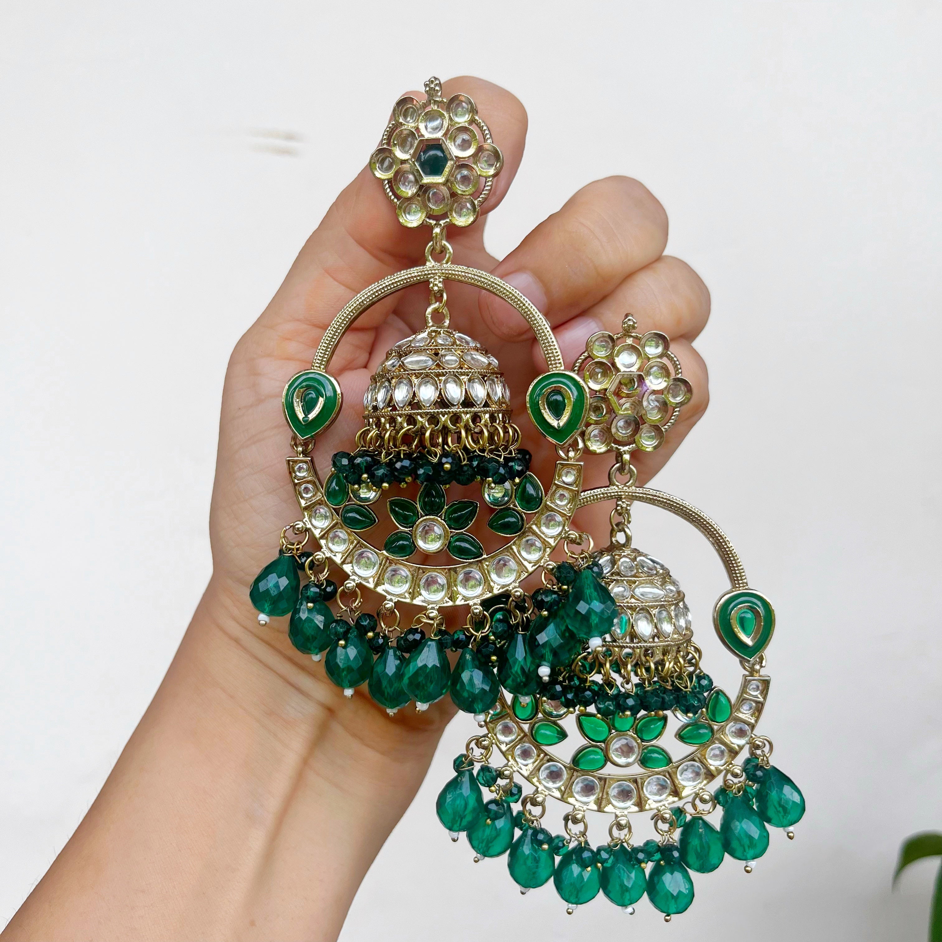 Aadhvi: Green Long Kundan Earrings with a Jhumka Motif